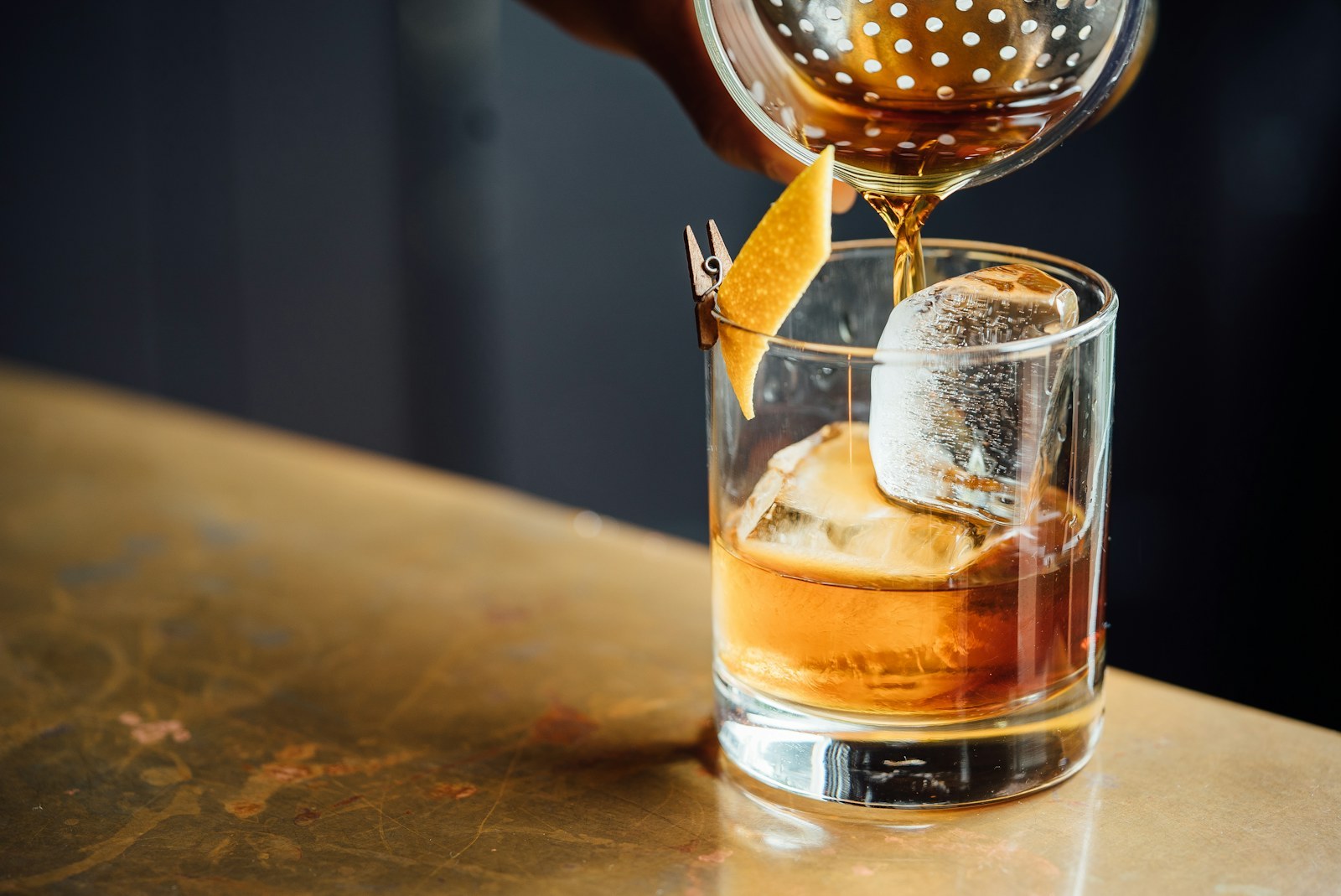 Whisky poured at the brass-lit Salon bar in the evening