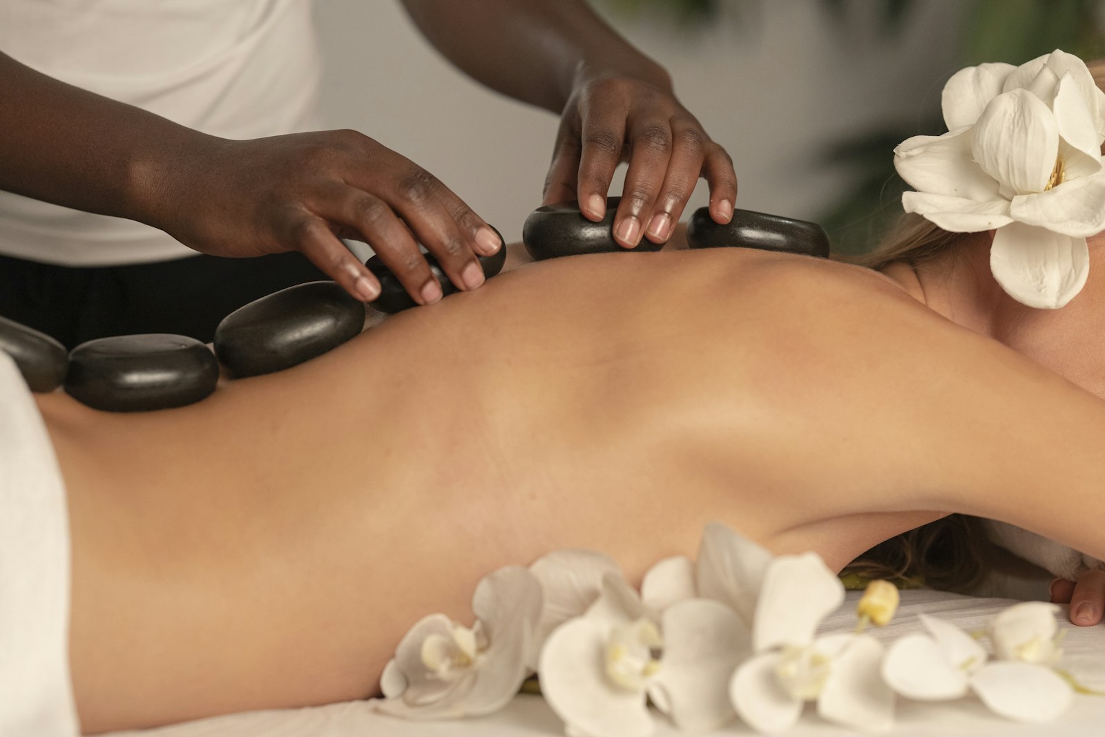 Candles, towels and botanical oils prepared for a signature spa ritual